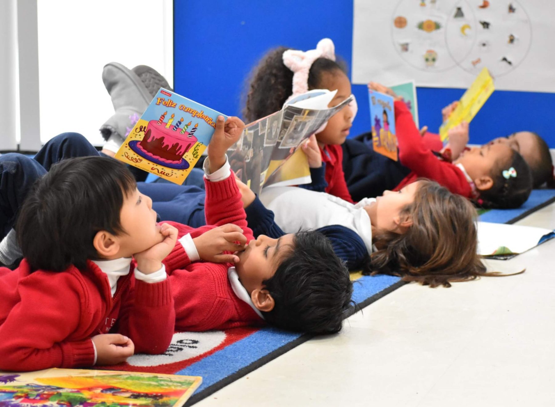 A group of students attending one of the top Hoboken private schools reading