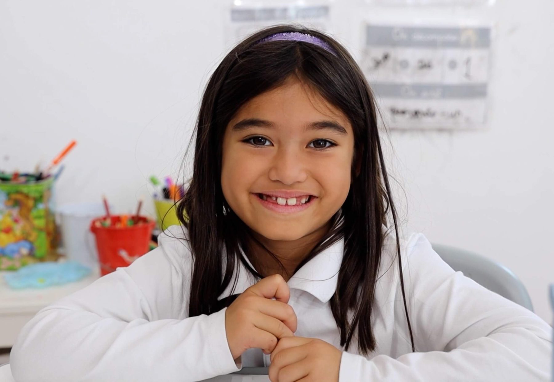 A student attending one of the top Hoboken private schools sitting in a classroom