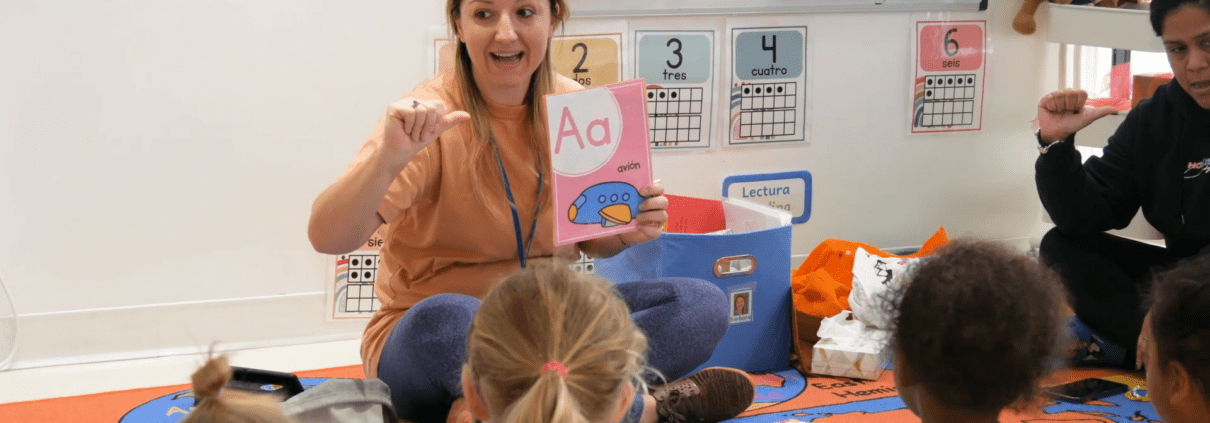 Our Spanish Nursery teacher guides toddlers in language learning.