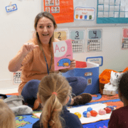 Our Spanish Nursery teacher guides toddlers in language learning.