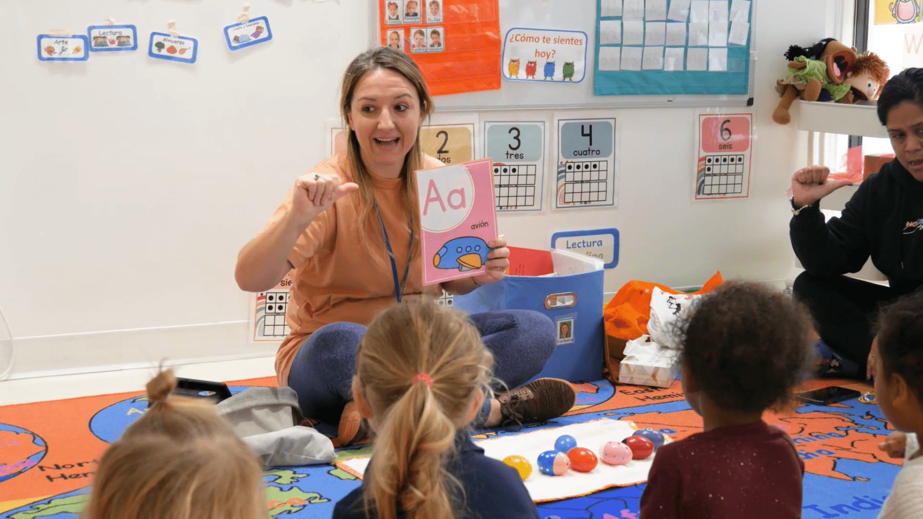 Our Spanish Nursery teacher guides toddlers in language learning.