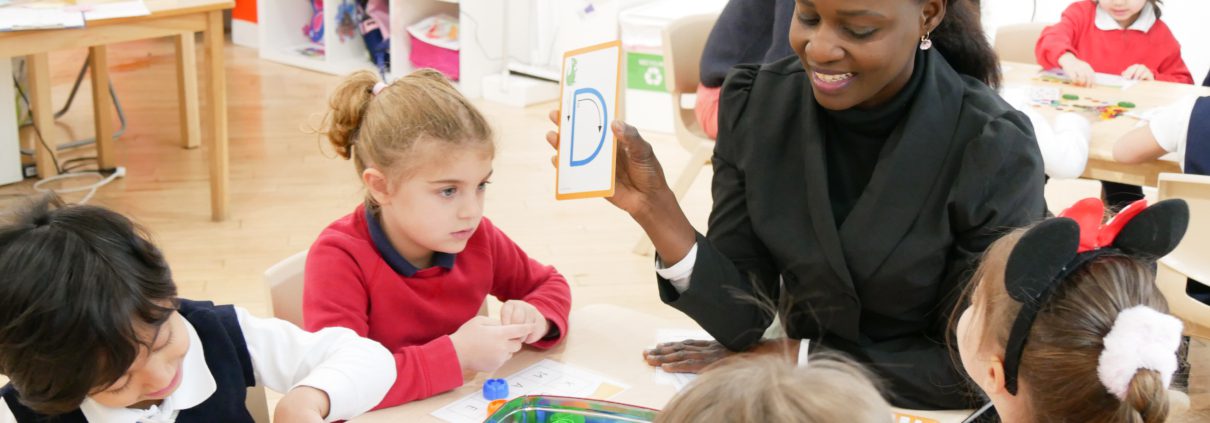 A parent happily accessing children's literacy skills