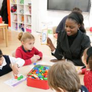A parent happily accessing children's literacy skills